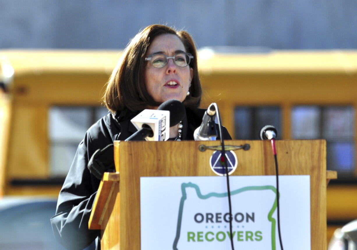 Oregon Governor Kate Brown speaks Tuesday, Feb. 13, 2018, in front of the Capitol building in Salem, Ore., Brown announced a public health crisis over addiction in the state along with an upcoming executive order to combat the problem.