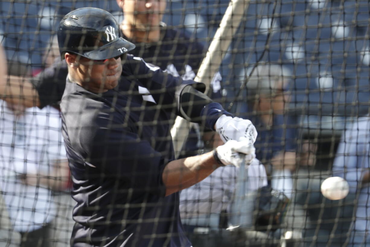 Seattle Seahawks quarterback Russell Wilson hits during batting practice before a baseball spring exhibition game against the Philadelphia Phillies, Monday, Feb. 26, 2018, in Tampa, Fla.