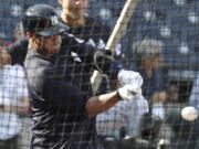 Seattle Seahawks quarterback Russell Wilson hits during batting practice before a baseball spring exhibition game against the Philadelphia Phillies, Monday, Feb. 26, 2018, in Tampa, Fla.