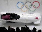 Driver Nadezhda Sergeeva and Anastasia Kocherzhova of the Olympic Athletes of Russia take a curve in their third heat during the women’s two-man bobsled final at the 2018 Winter Olympics in Pyeongchang, South Korea, on Wednesday.