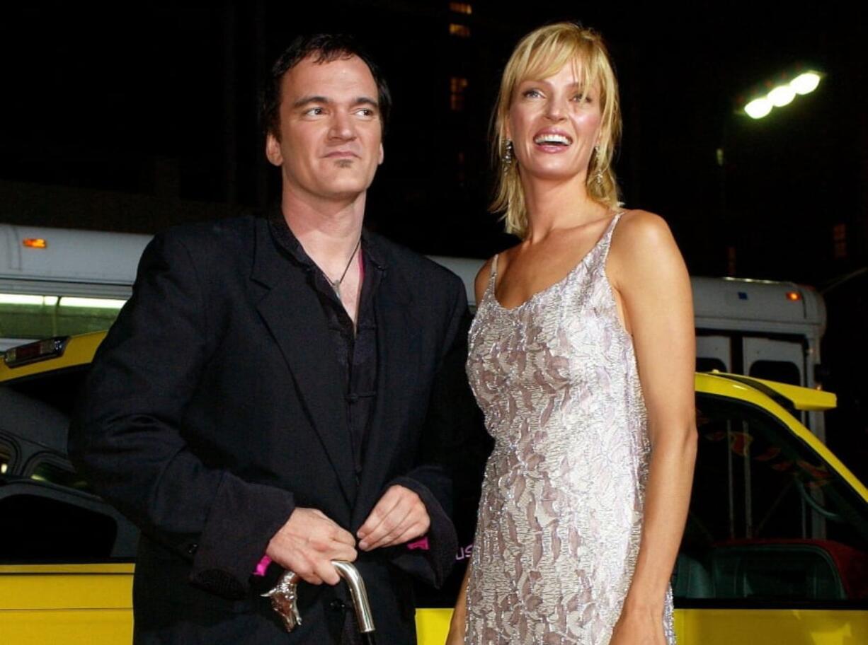 FILE - In this Sept. 29, 2003 file photo, director of the film “Kill Bill: Volume 1,” Quentin Tarantino, left, and actress Uma Thurman arrive at the premiere of the film in Los Angeles. Tarantino has expressed sorrow for the car crash that injured Uma Thurman during shooting of “Kill Bill,” calling it the biggest regret of his life. He said he had test-driven the route himself and believed it to be safe, and persuaded Thurman she could drive it.