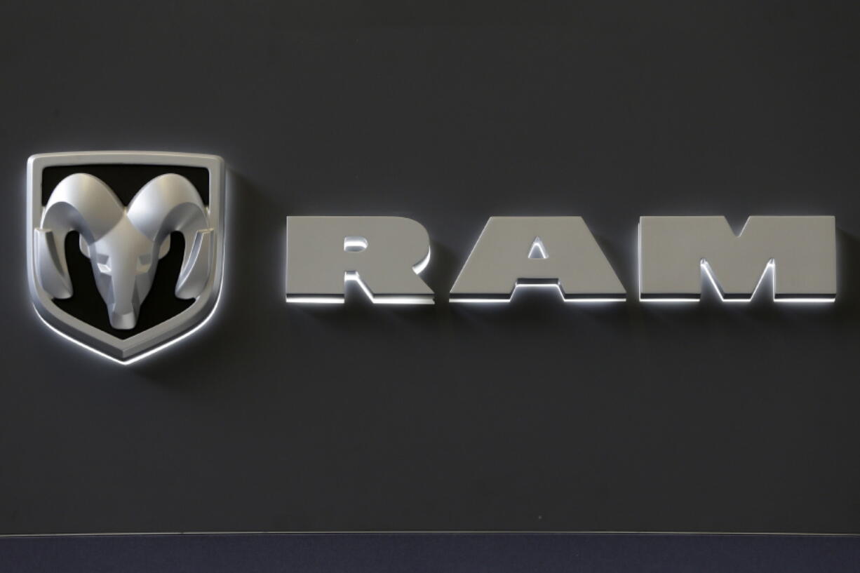 The Ram truck logo appears on a sign at the Pittsburgh Auto Show in Pittsburgh in February 2013. Fiat Chrysler is recalling about 229,000 Ram trucks, mostly in North America, because they can be shifted out of park without a key in the ignition or a foot on the brake. Gene J.