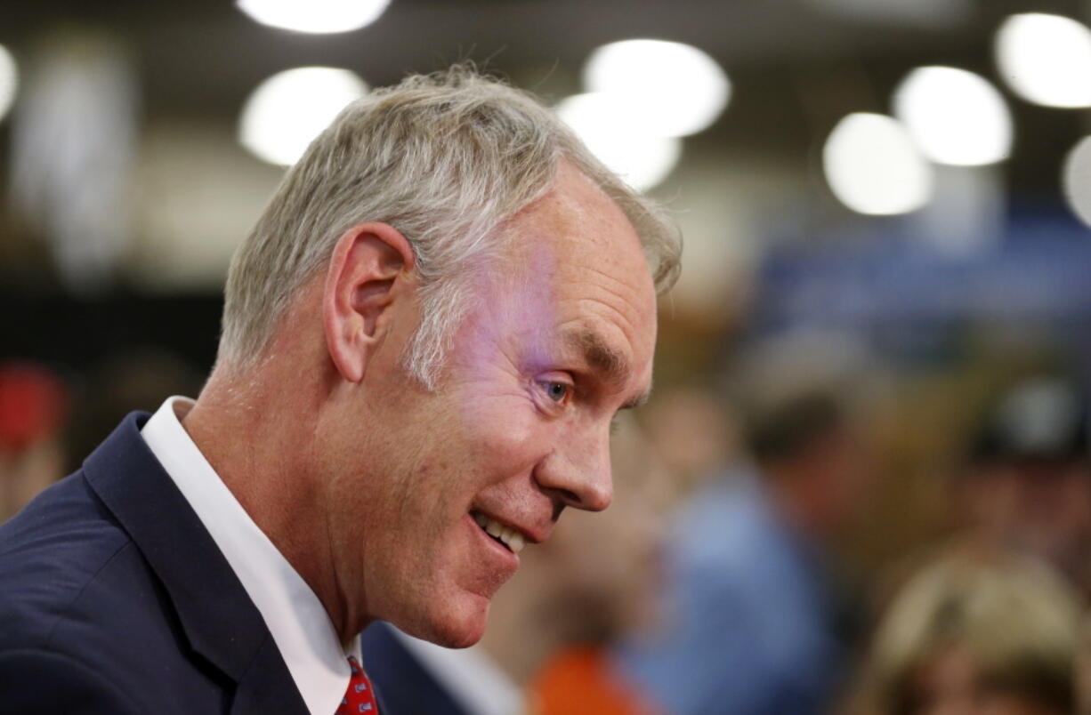 U.S. Interior Secretary Ryan Zinke speaks to reporters at a conservation announcement at the Western Conservation and Hunting Expo in Salt Lake City. On Friday, Zinke will announce he will revise proposed new regional boundaries for the Interior Department as part of a major reorganization of the agency. The new boundaries would more closely follow state lines, a change from his earlier proposal, which largely ignored state boundaries and relied mostly on rivers and other natural features.