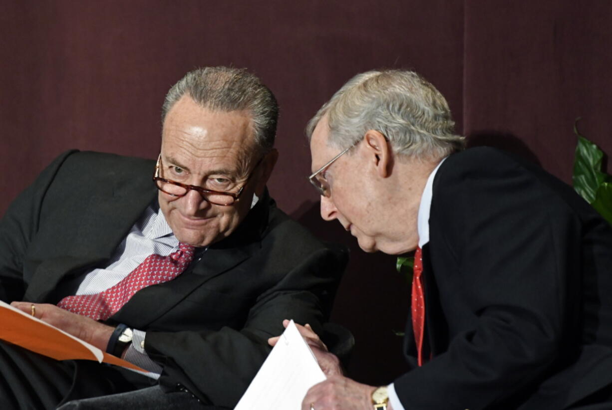 Senate Minority Leader Charles Schumer, D-N.Y., left, talks with Senate Majority Leader Mitch McConnell, R-Ky., before his speech at the McConnell Center’s Distinguished Speaker Series on Monday in Louisville, Ky. (AP Photo/Timothy D.