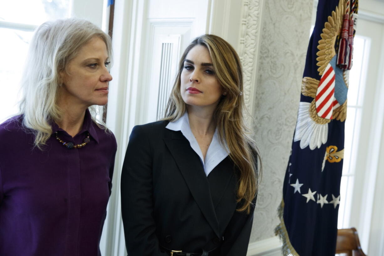 White House Communications Director Hope Hicks, right, stands with White House senior adviser Kellyanne Conway during a meeting in the Oval Office between President Donald Trump and Shane Bouvet, on Friday in Washington.