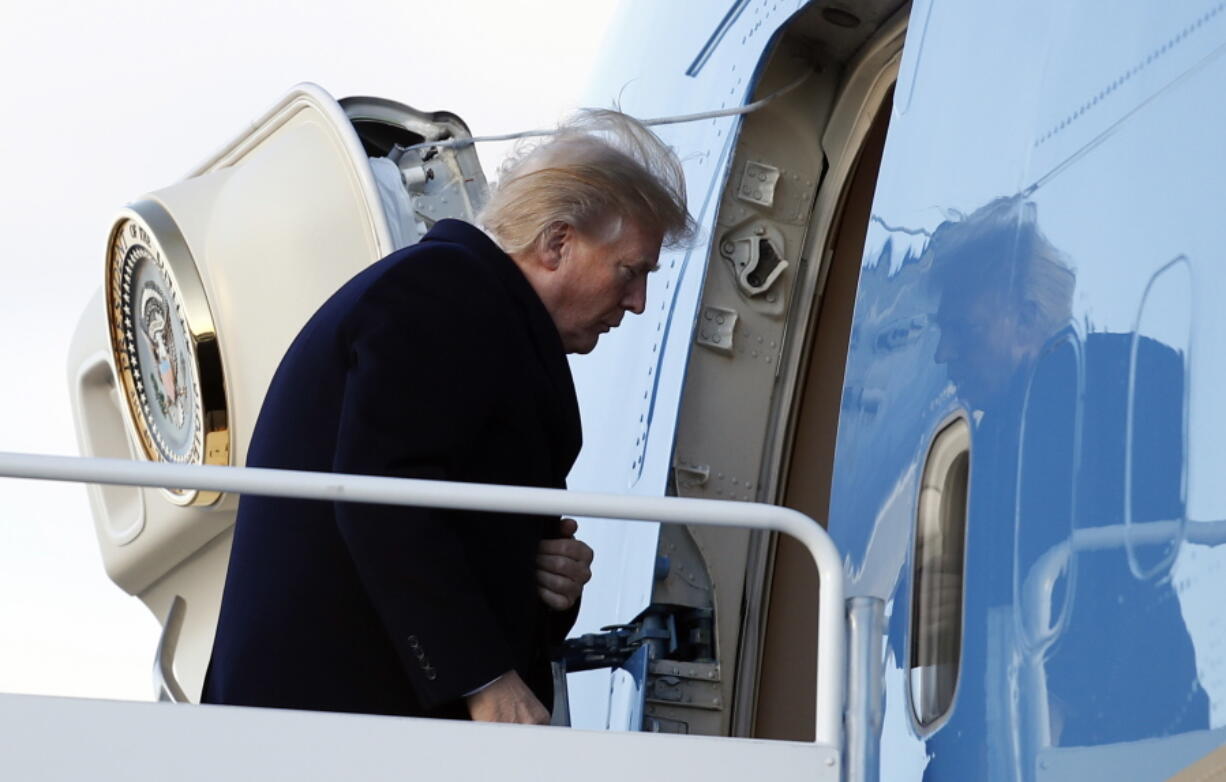 President Donald Trump boards Air Force One, Friday, Feb. 2, 2018, in Andrews Air Force Base, Md., en route to Palm Beach International Airport, in West Palm Beach, Fla.