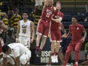 Washington State players celebrate a 78-76 win over California in an NCAA college basketball game Thursday, Feb. 22, 2018, in Berkeley, Calif. (AP Photo/D.