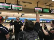 Hudson's Bay's Halie Martin (facing) yells out a chant after a strike during Friday's 3A state bowling championships. Martin placed fourth (1,120 pins).