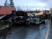 A truck carrying construction materials lost control and hit the jersey barrier between the north and southbound lanes of Interstate 5 south of Chehalis early Tuesday morning. A Vancouver man was injured in the crash.