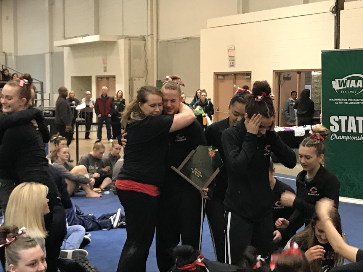 The Camas Papermakers celebrate the program's first-ever Class 4A state championship trophy after stepping off the podium. Camas topped four-time reigning champion Woodinville.