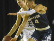 Skyview's  Alex Schumacher (0) defends against Gonzaga Prep's Liam Lloyd (21) during a WIAA 4A State Hardwood Classic's 2nd round basketball game at the Tacoma Dome on March 1, 2018 in Tacoma.  Gonzaga Prep beat Skyview 59-52.