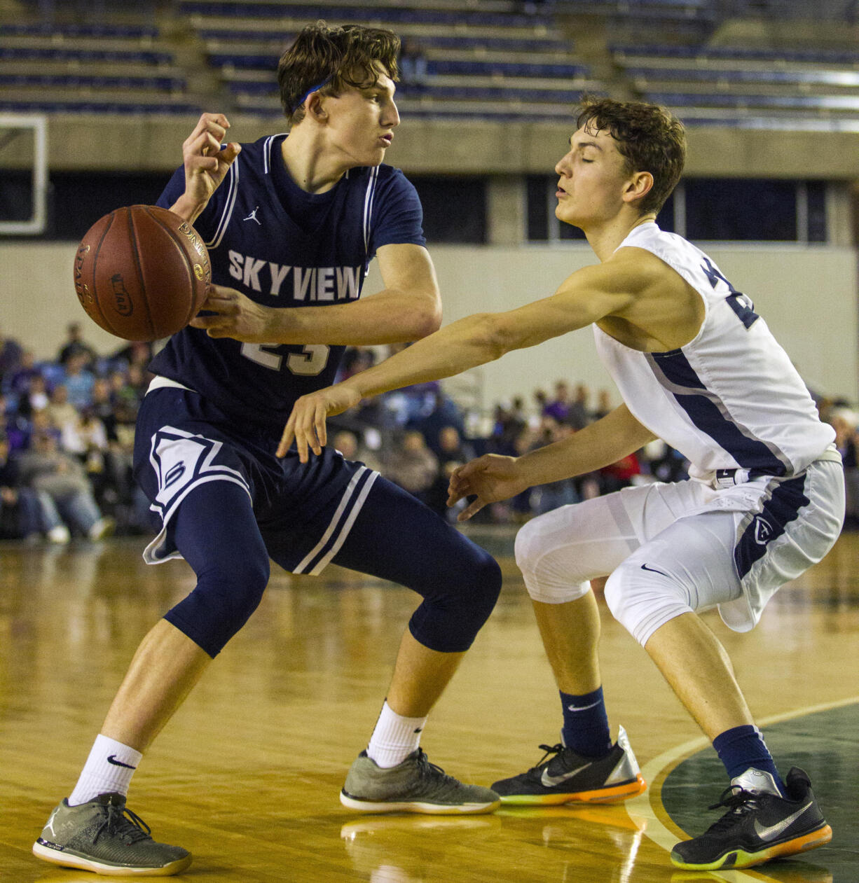 Skyview's Kyle Gruhler (23) has the ball knocked away by Gonzaga Prep's Devin Culp (20) during a WIAA 4A State Hardwood Classic's 2nd round basketball game at the Tacoma Dome on March 1, 2018 in Tacoma.  Gonzaga Prep beat Skyview 59-52.