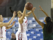 Camas's Mariana Payne (21) blocks a shot by Kentridge's Tresai Mccarver (12) during a WIAA 4A State Hardwood Classic's 3rd round basketball game at the Tacoma Dome on March 2, 2018 in Tacoma.  Kentridge beat Camas 60-44.