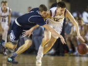 Skyview's Cole Grossman, left, and Enumclaw's Peter Erickson, right, scrambles for a loose ball during the WIAA 4A State Hardwood Classic's fourth and sixth place basketball game at the Tacoma Dome on March 2, 2018 in Tacoma.  Enumclaw beat  Skyview 62-57 to take fourth place.