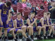 Columbia River upper classman Kiran Bear (22), Nasseen Gutierrez (32), Evan Dirksen (15), Caden Dezort (20), Jacob Hjort (12) and Nate Snook (1) cheer on their teammates during the final seconds against Selah in the WIAA 2A boys state basketball tournament on Saturday, Mar. 3, 2018, at the Yakima Valley SunDome. The Columbia River Chieftains took 6th place in state after losing to the The Selah Vikings 58-51.