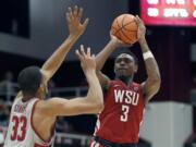 Washington State forward Robert Franks (3) takes a shot over Stanford forward Trevor Stanback (33) during the second half of an NCAA college basketball game Saturday, Feb. 24, 2018, in Stanford, Calif. Stanford won 86-84.