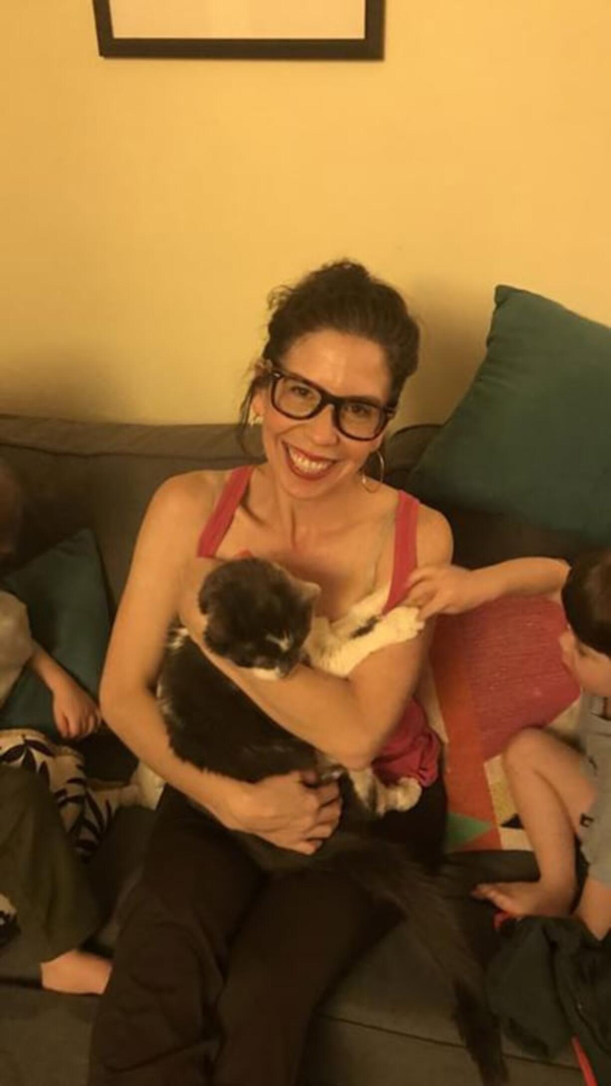 Betsy Boyd and her twin sons, Texas and Miner, sit with the family cat Stanley. Boyd, a part-time faculty member at the University of Baltimore, spent $19,000 on a kidney transplant for Stanley.