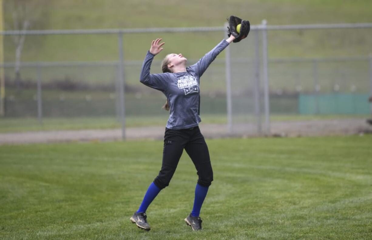 La Center junior Madi Osborne, catches the ball in the outfield during practice. The Wildcats have just one senior.