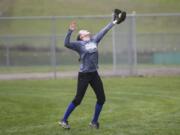 La Center junior Madi Osborne, catches the ball in the outfield during practice. The Wildcats have just one senior.