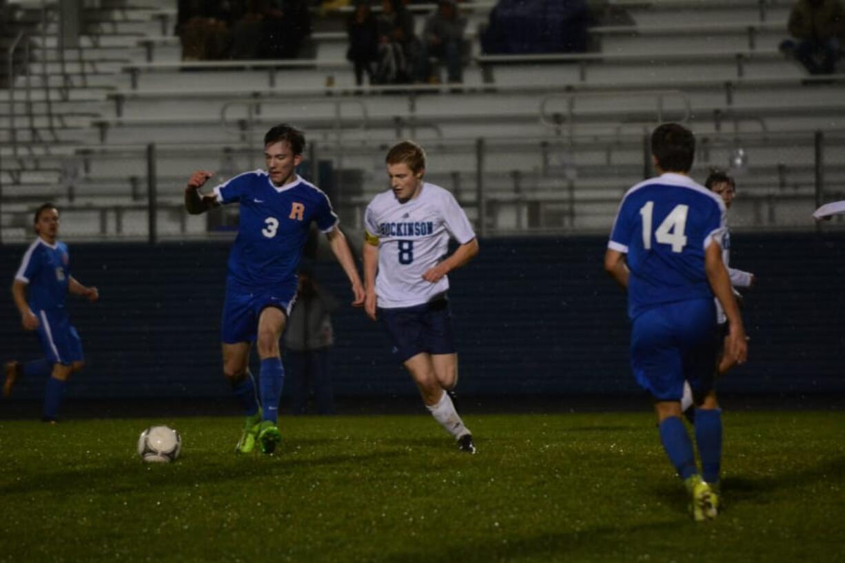 Ridgefield forward Joey Vossenkuhl shields that ball from Hockinson’s Adam Carter in the first half of a 2-1 Spudders win on Friday at Hockinson High School.