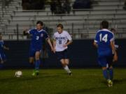 Ridgefield forward Joey Vossenkuhl shields that ball from Hockinson’s Adam Carter in the first half of a 2-1 Spudders win on Friday at Hockinson High School.