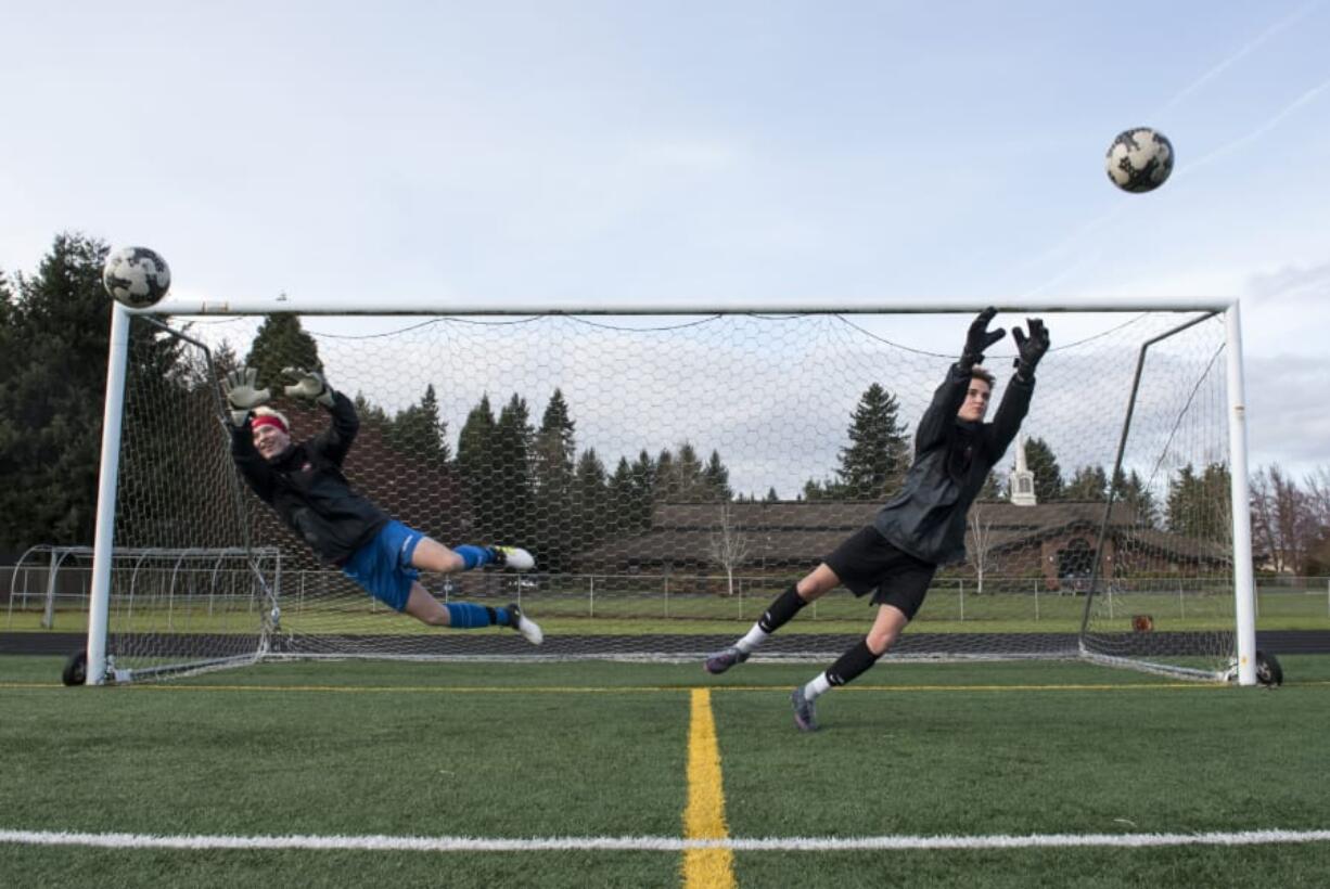 Prairie High School seniors CJ Henry, left, and Tristan Glaser, right, are pictured at practice in Vancouver on Wednesday evening, March 28, 2018. The best friends and fellow goalies have both committed to play at Evergreen State College next year.