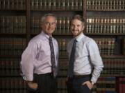 Barry Brandenburg of Ridgefield and his son Bennett Brandenburg of Vancouver at their office in downtown Vancouver. Bennett Brandenburg completed a state bar program last year that allows students to forgo law school in exchange for learning under an experienced attorney. After Bennett passed the bar exam last fall on his first try, the father-son duo began working together.