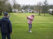 Fairway Village resident Dave Mercer, left, watches as Elaine Saeed tees off on the second hole during a recent golf outing on the Fairway Village course. The 55-and-older community is part a census block group with the oldest median age — 72.6 — in the county.