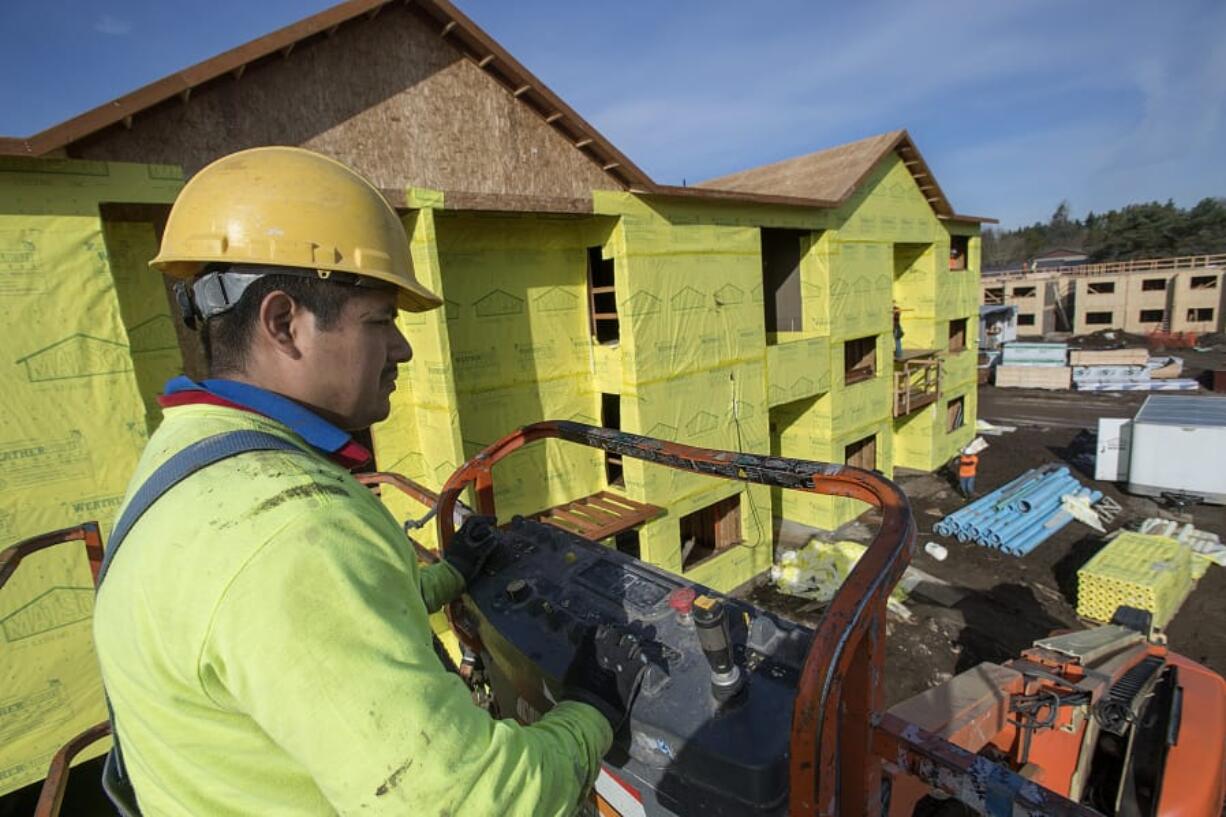 Francisco Petonilo of Matson Siding takes in a bird’s-eye view of K West Apartments, a 192-unit complex being built in central Vancouver by DBG Properties. This is the largest infusion of affordable housing to date that uses the city’s tax exemption program.