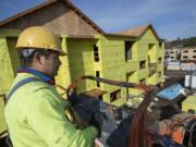 Francisco Petonilo of Matson Siding takes in a bird’s-eye view of K West Apartments, a 192-unit complex being built in central Vancouver by DBG Properties. This is the largest infusion of affordable housing to date that uses the city’s tax exemption program.