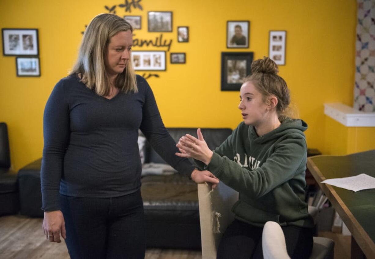 Shari Perea, left, and her daughter, Quinn Perea, 12, discuss a letter Quinn wrote to Rep. Jaime Herrera Beutler concerning the recent school shootings in Florida and safety in schools, at their home in Vancouver. Quinn, echoing the action of children around the nation, has used the shooting at Marjory Stoneman Douglas High School as an opportunity to press for gun reform.