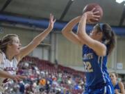 La Center's Taylor Mills (22), right, shoots over Medical Lake's Ellie Acord (22) during the WIAA 1A girls state basketball tournament on Thursday, Mar. 1, 2018, at the Yakima Valley SunDome. Medical Lake Cardinals defeated La Center Wildcats 41-31.