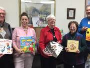 Esther Short: The Assistance League of Southwest Washington donated more than 900 books to Open House Ministries’ family shelter as part of the organization’s nationwide League of Literacy Drive. From left: Open House Ministries Board President Dick James; Open House Ministries Executive Director Renee Stevens; Nancy Gaston, League of Literacy book drive coordinator for Assistance League of Southwest Washington; Open House Ministries Board Secretary Claudia Dalton; and Mark Maggiora, Open House Ministries board member.