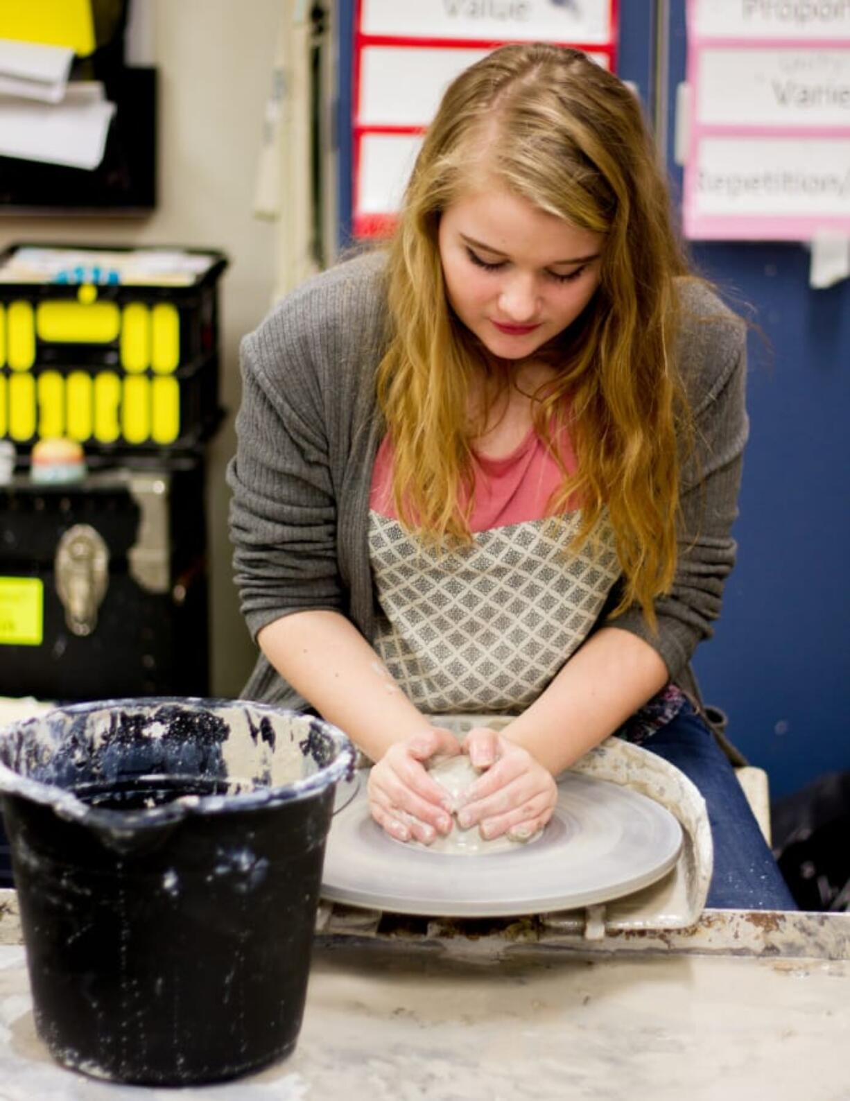 Woodland: Woodland Middle School eighth-grader Maddison Wale uses the wheel during the school’s new pottery club.