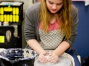 Woodland: Woodland Middle School eighth-grader Maddison Wale uses the wheel during the school’s new pottery club.