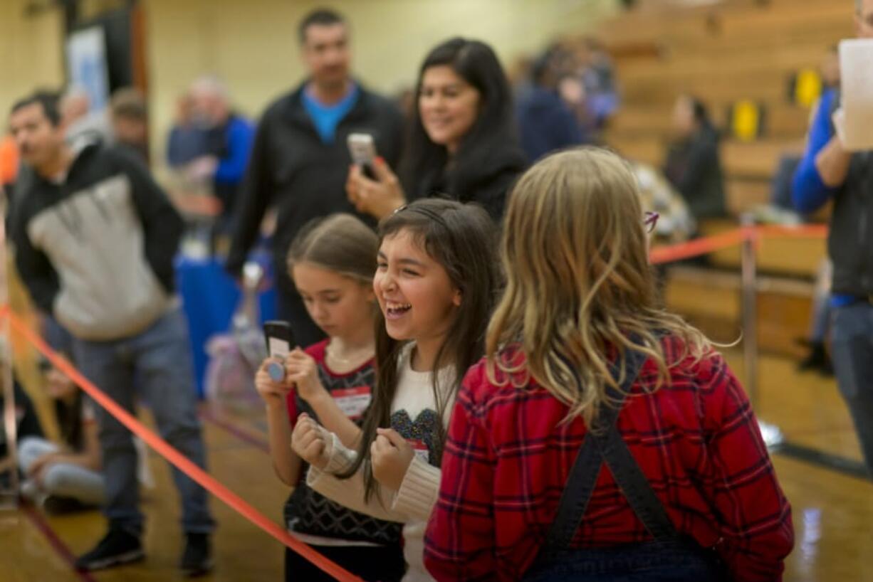 Bella Torres, 9, of Pioneer Elementary School, beams after a solar car she built with her team won her race.