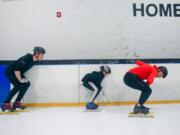 From left: Justin Machus, Bennet Haffner, 12, and Brooks Clemens refine their technique during speed skating practice at Mountain View Ice Arena Sunday afternoon.