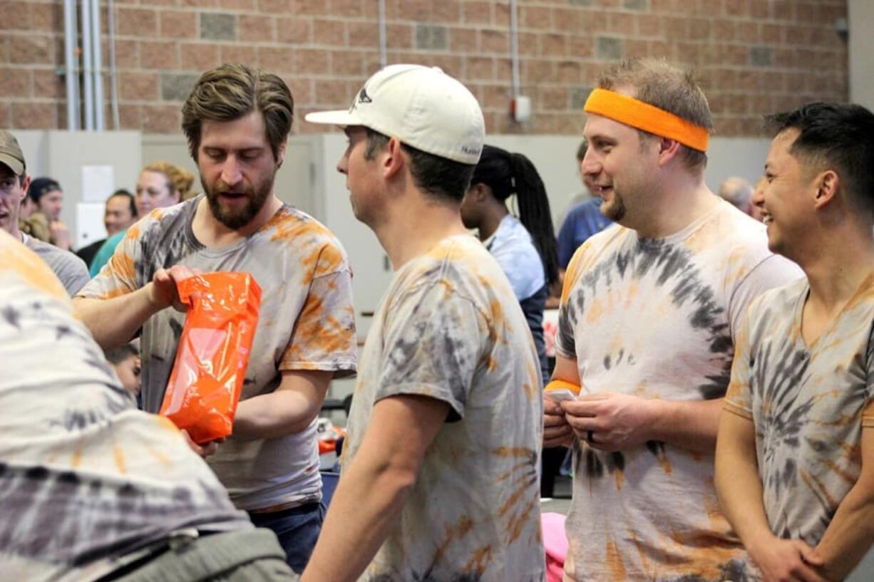 North Image: Competitors in the Clark County Family YMCA’s third annual TENtastic Decathlon participate in one of the day’s events. The decathlon raised $10,000 for the organization.