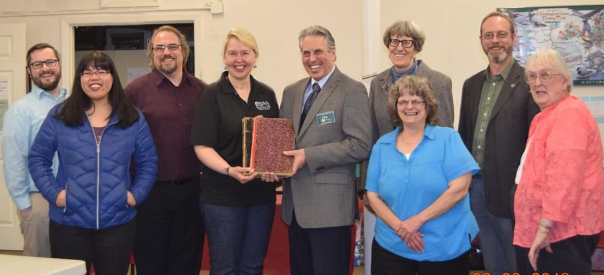 Edgewood Park: Clark County Genealogical Society finished a yearlong project to digitize tax ledgers from 1886 and 1891. From left: Bradley Richardson of the Clark County Historical Museum; Erin Enos, a Washington State University Vancouver intern; Robert Schimelpfenig, a WSUV archivist; Tracy Rebstock of the Washington State Archives staff; Brian Runyan, Clark County Genealogical Society president; Lois Bosland, a genealogical society transcriber; Ann Rowland, a society transcriber; Steve Fountain, a WSUV professor; and Lethene Parks, society volunteer project coordinator.