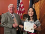 Camas: Fort Vancouver chapter of Sons of the American Revolution President Jeff Lightburn presents Camas High School junior Monica Chang with her certificate and check for winning the chapter’s essay contest for her work, “Freedom of the Press: A pillar of modern democracy.”