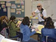 Washougal: Rob Pullen, a parent in the Washougal School District, performed with his violin with Gause Elementary School students.