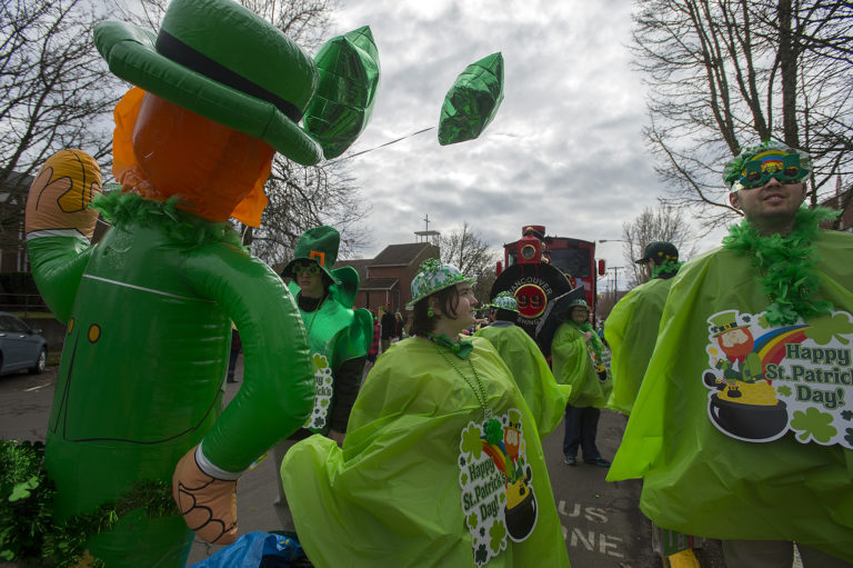 Lauren Graham, center, and Alexi Resoff of the Vancouver School District's GATE Program get into the spirit of the annual Paddy Hough Parade as they prepare to leave Hough Elementary School on Friday afternoon, March 16, 2018. The pair were two of hundreds of participants that celebrated the Saint Patrick's Day holiday in style.