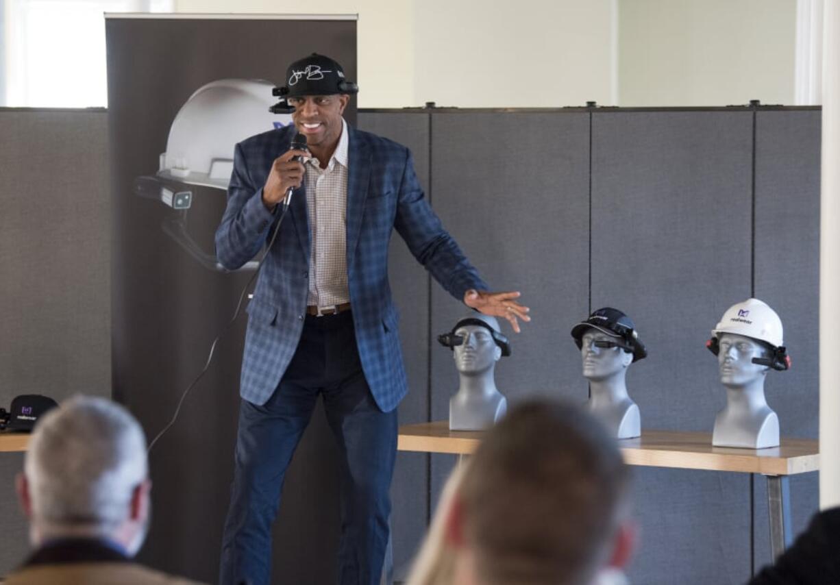 Retired professional basketball player Jerome Williams speaks during the GROW Clark County networking event, which featured hardware company RealWear. Williams joined the company’s advisory board in February and hopes to use its head-mounted computer to coach basketball.