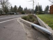 A rain garden, also known as a bioretention facility, is pictured along Northeast 98th Avenue in Vancouver’s Oakbrook Neighborhood. Rain gardens improve stormwater quality by filtering out some pollutants that would otherwise end up in streams and other waterways. The state Department of Ecology recently offered $220 million in funding to build clean water facilities around the state.