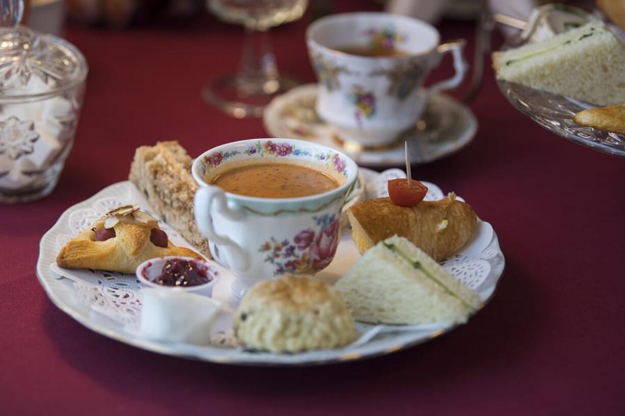 A selection of items on the Luncheon Plate, foreground, with a cup of Earl Grey tea at Sweet Peas Tea Room in Battle Ground.