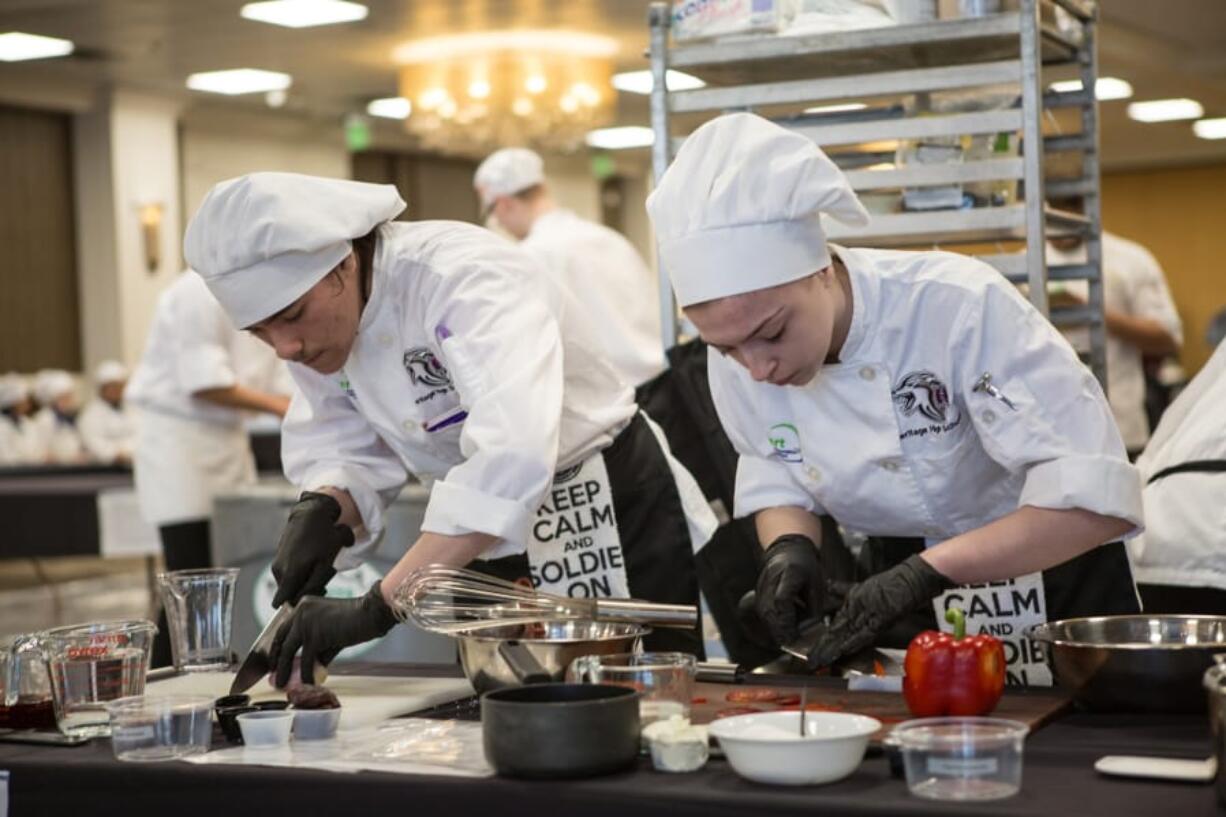 Orchards: Heritage High School students traveled to Spokane to compete in the ProStart invitational, a cooking competition in which they had to prepare a three-course meal in 60 minutes using butane burners.