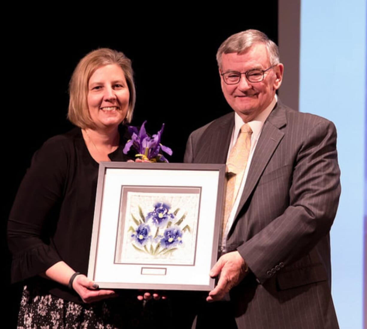 Landover-Sharmel: Evergreen Public Schools board member Julie Bocanegra accepting her 2018 Iris award from former Evergreen Superintendent John Deeder.