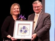 Landover-Sharmel: Evergreen Public Schools board member Julie Bocanegra accepting her 2018 Iris award from former Evergreen Superintendent John Deeder.