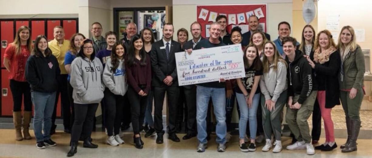 Camas: Union High School teacher Don Rasmussen was presented with a check during his fourth-period Advanced Placement psychology class. A student in that class nominated him for the Evergreen School District Foundation’s Educator of the Year award.