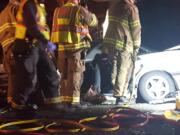 Firefighters respond to a fatal head-on crash on Washougal River Road Sunday night.